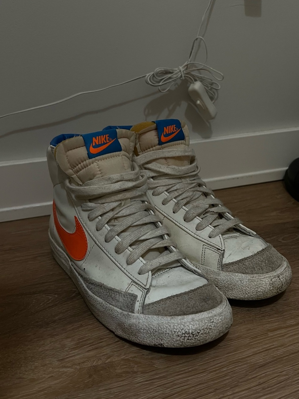 Nike Men’s High-Top Sneakers in White with Orange Swoosh and Blue Tongue Accents